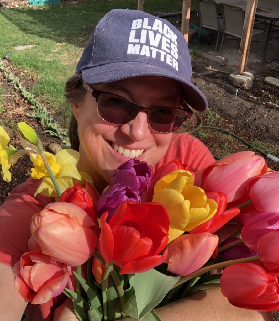 Leslie Madsen holding a bunch of tulips